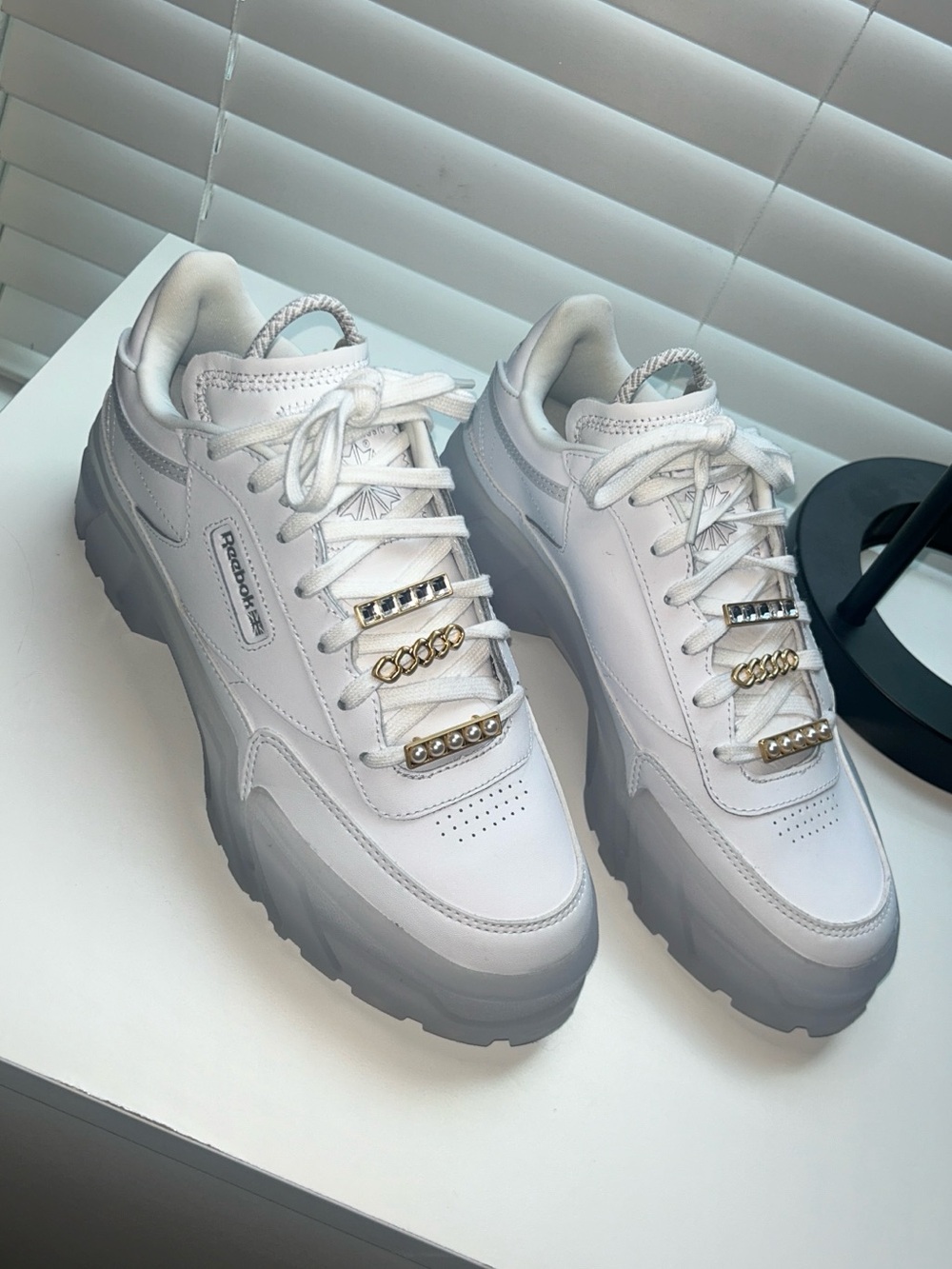 Reebok Women’s White Platform Sneakers with Gold Accents